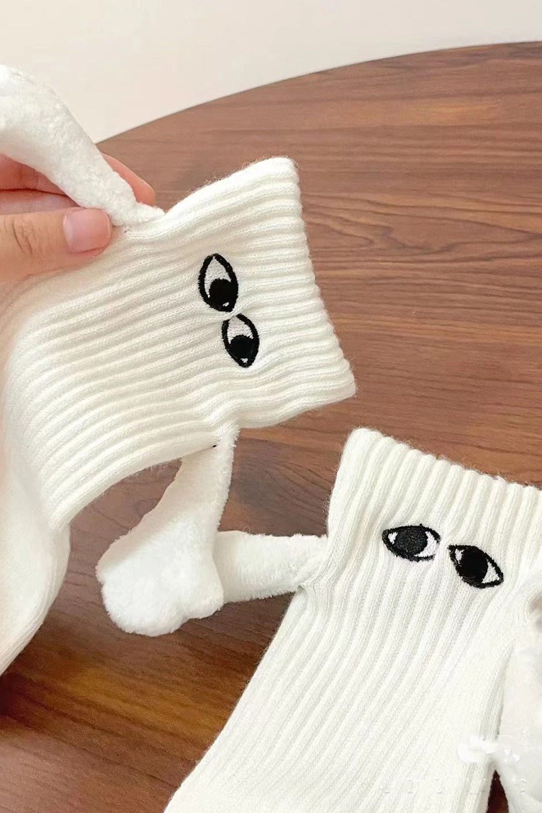 Hand Holding Socks